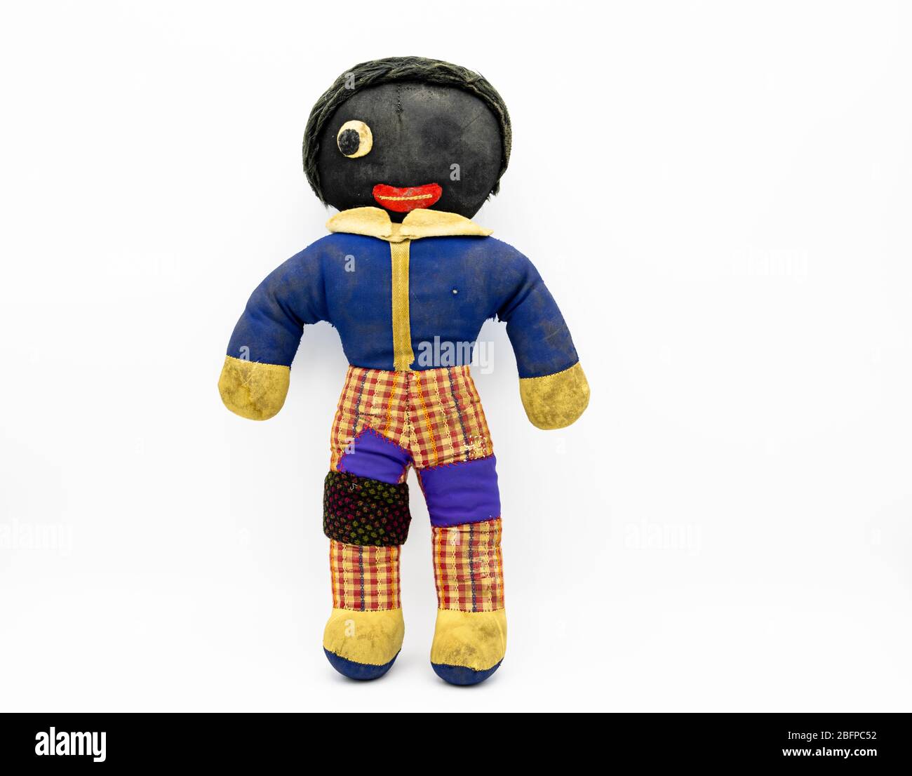 A worn out, patched and repaired golliwog doll with only one eye, a fictional character by Florence Kate Upton in children's books in the 19th century Stock Photo