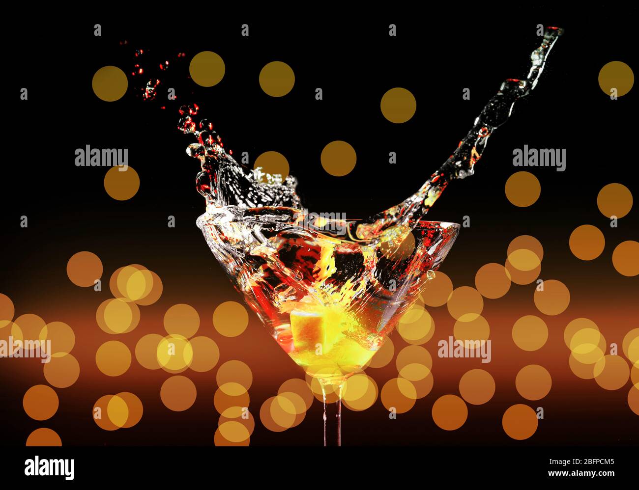 Cocktail Background Splash Colorful cocktail with splash on lights background Stock Photo - Alamy