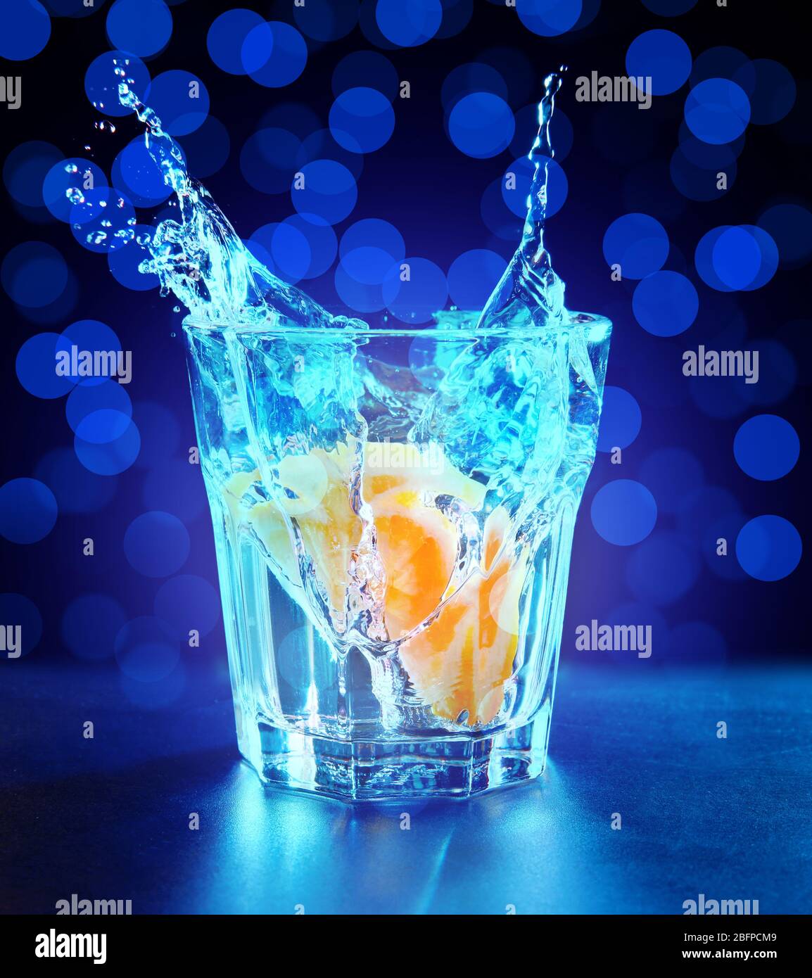 Cocktail Background Splash Colorful cocktail with splash on lights background Stock Photo - Alamy