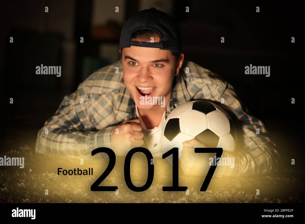 Text FOOTBALL 2017 and fan on background Stock Photo