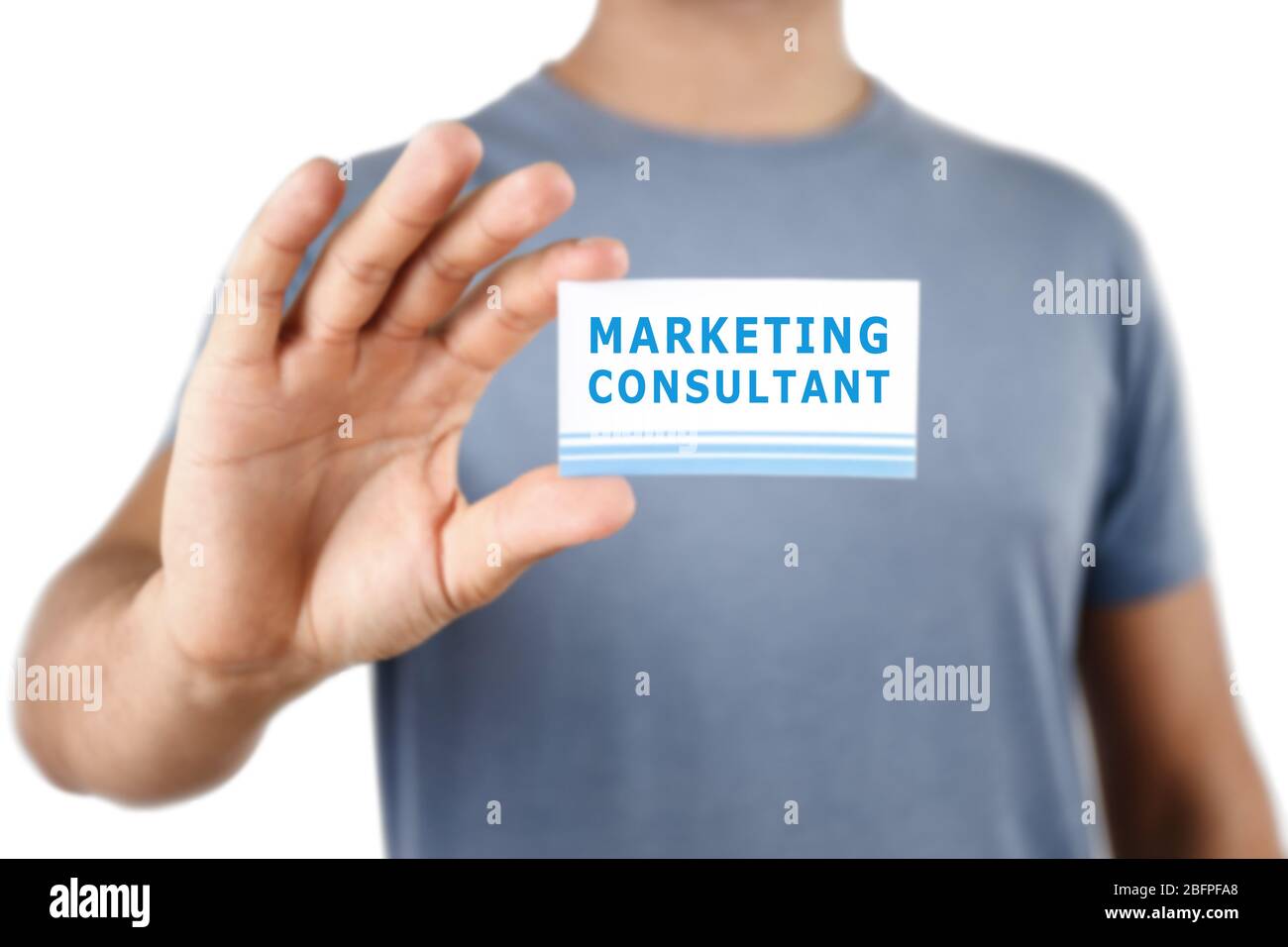 Man holding business card in hand, closeup. Marketing consultant concept Stock Photo