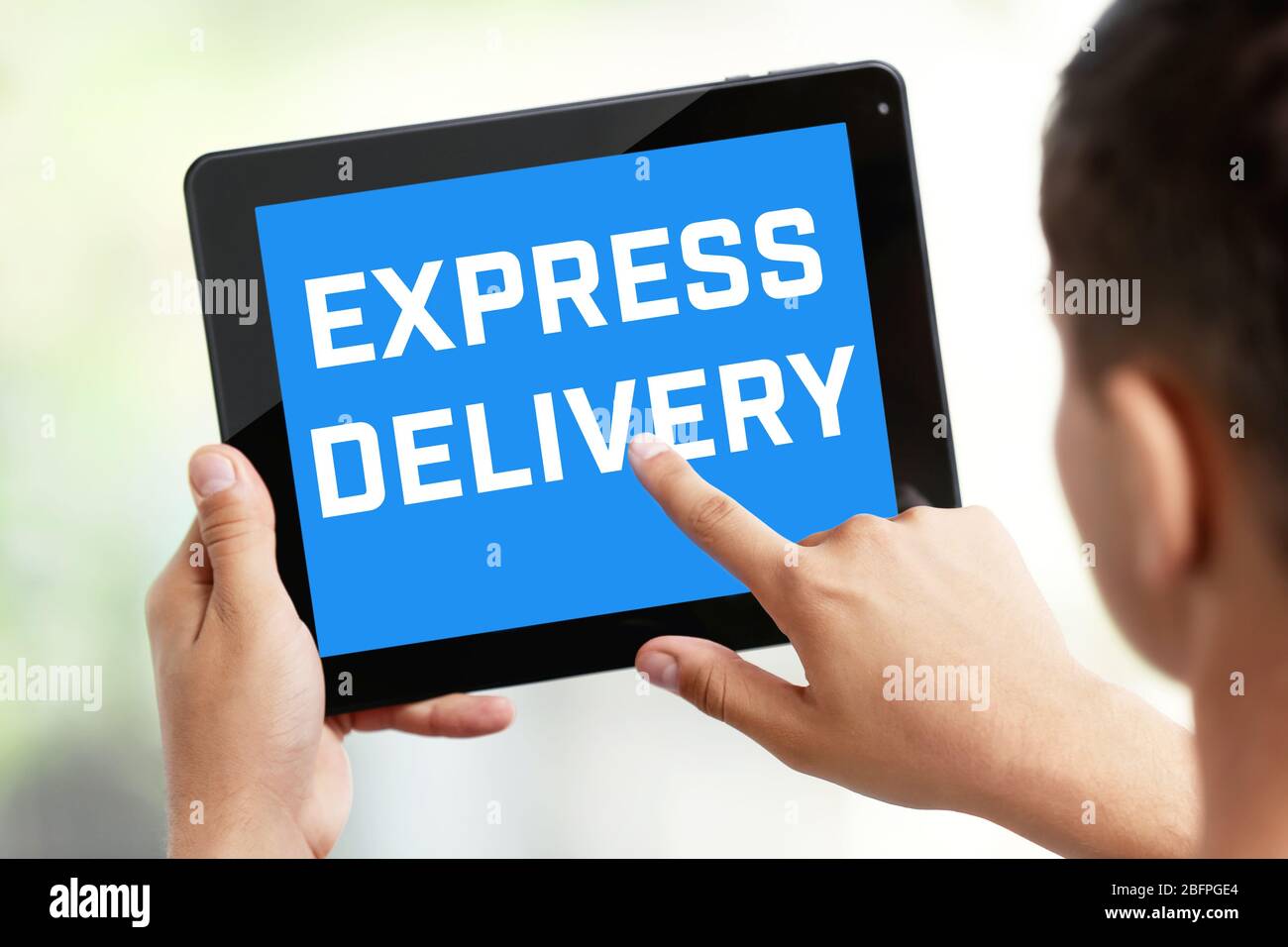 Delivery concept. Man using tablet, closeup Stock Photo
