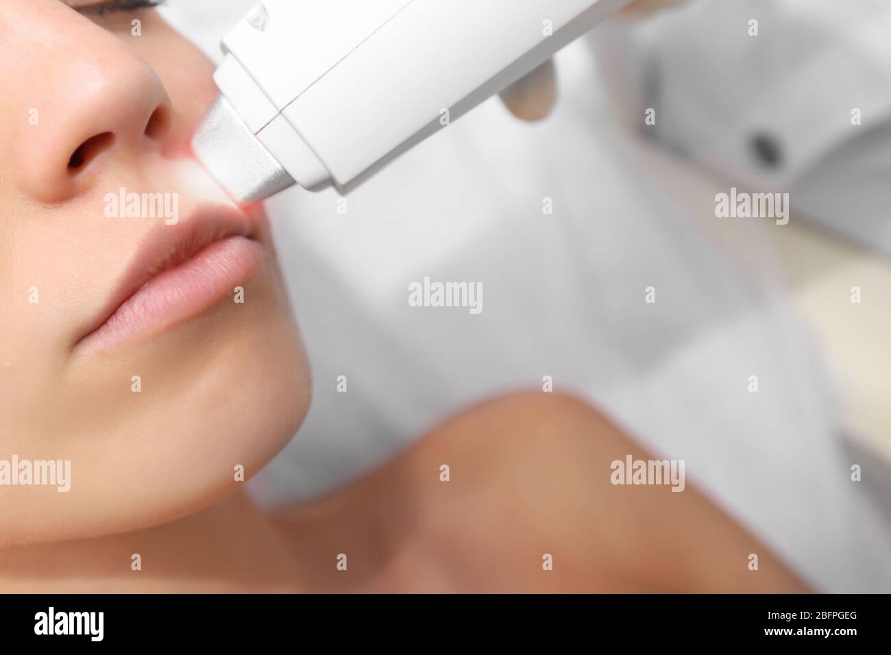 Woman On Laser Hair Removal Procedure At Beauty Salon Epilation Concept Stock Photo Alamy