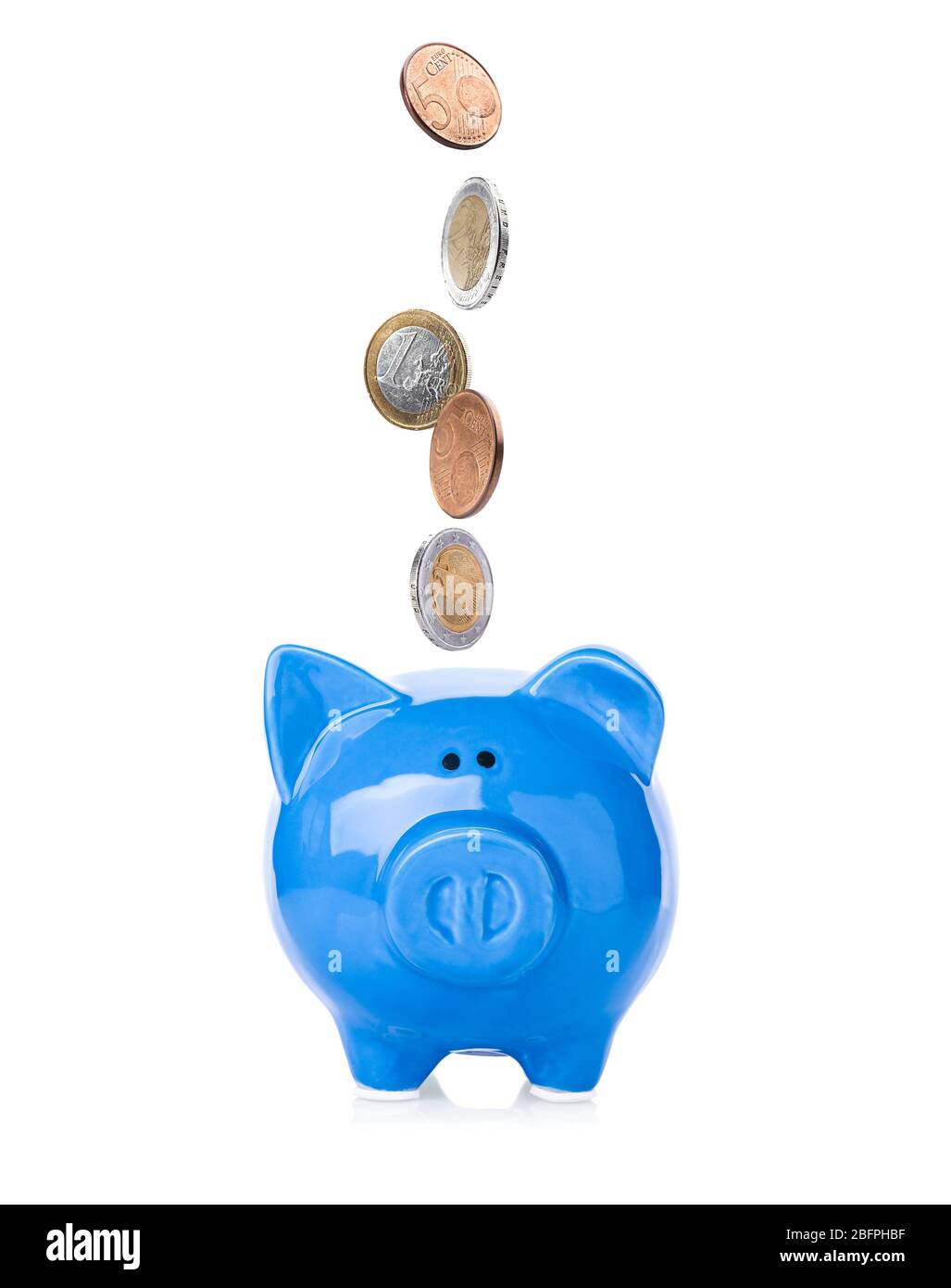 Coins falling into piggy bank on white background. Money savings ...