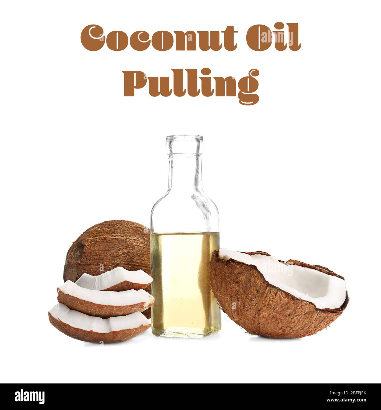 Nut and bottle of coconut oil pulling on white background Stock Photo