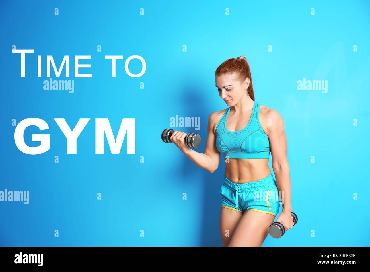 Fitness quotes. Text TIME TO GYM and young woman training with dumbbells on color background Stock Photo