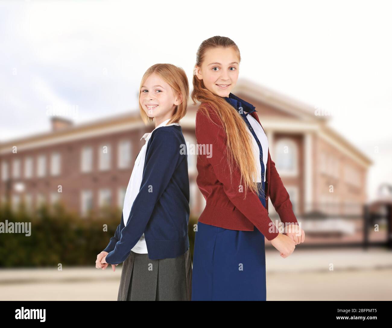 Two girls school uniform outdoor hi-res stock photography and images ...