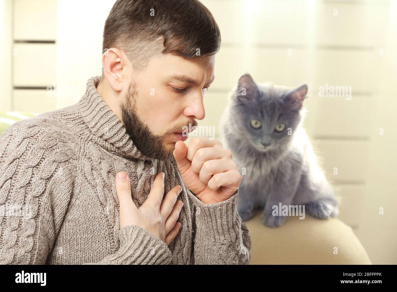 Ill man suffering from cough and pet on background. Concept of