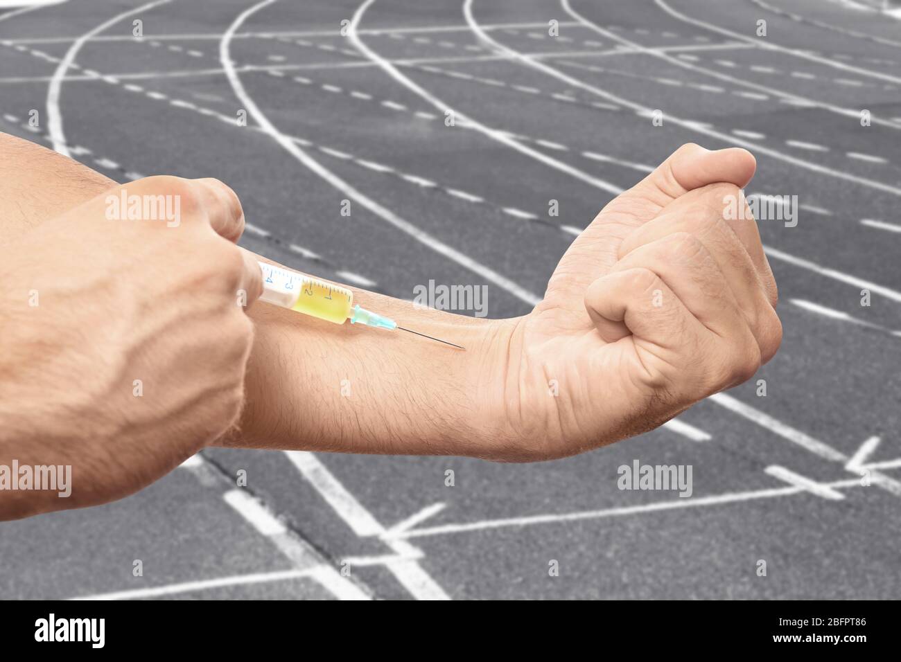 Man injecting steroids and running track on background, closeup. Sport