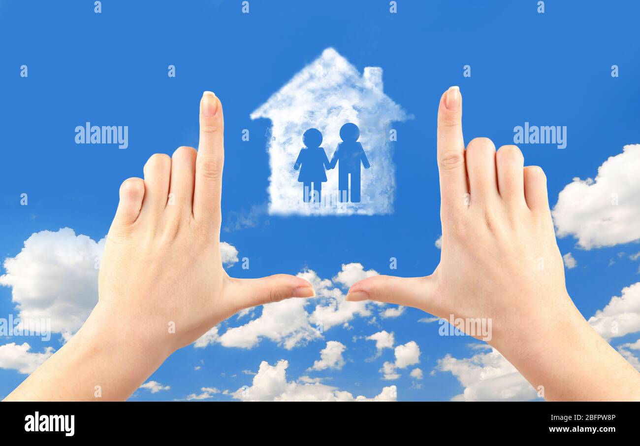 Female hands and house shape cloud on sky background Stock Photo - Alamy