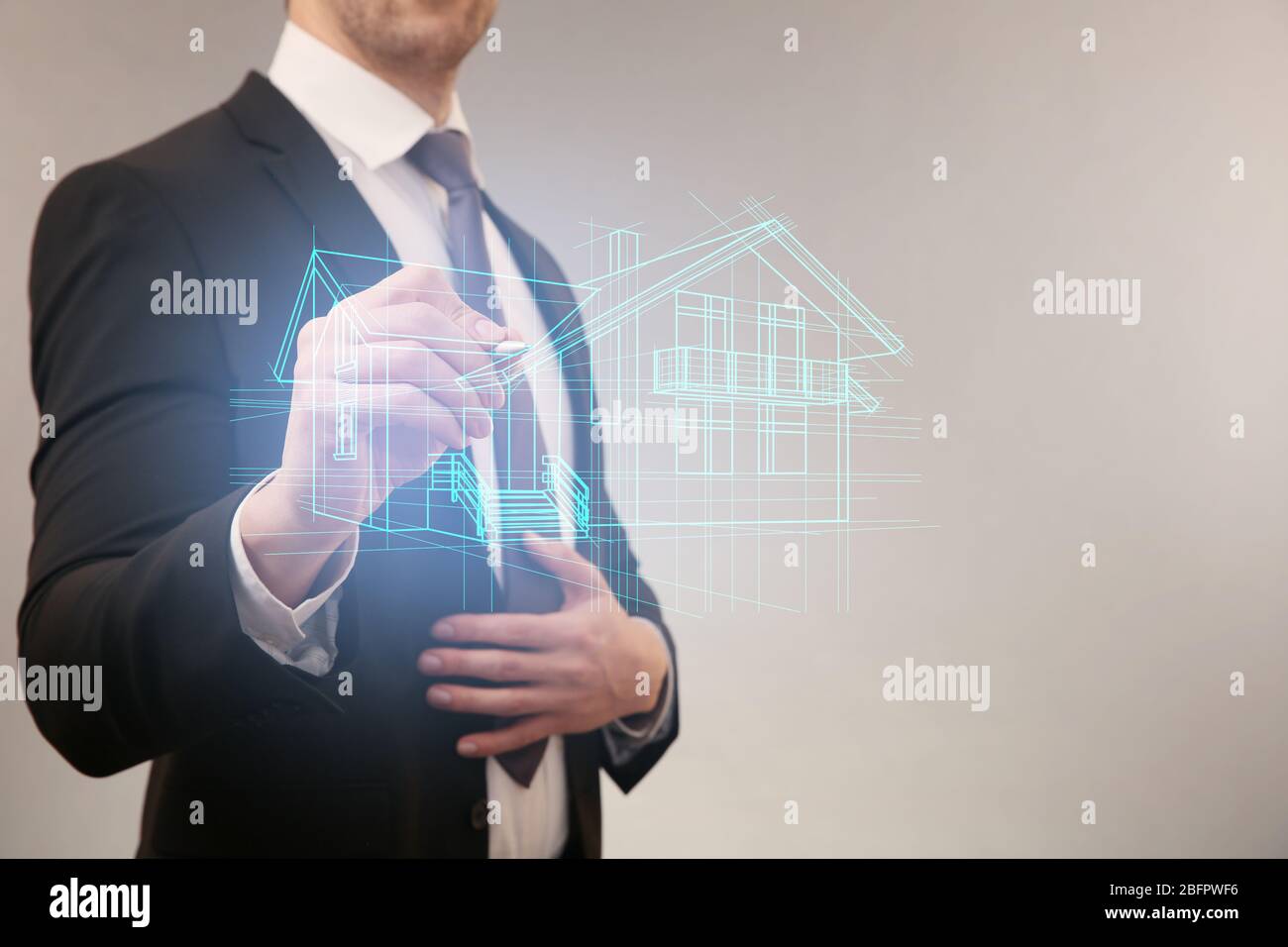 Real estate agent drawing house on virtual screen against light background  Stock Photo - Alamy