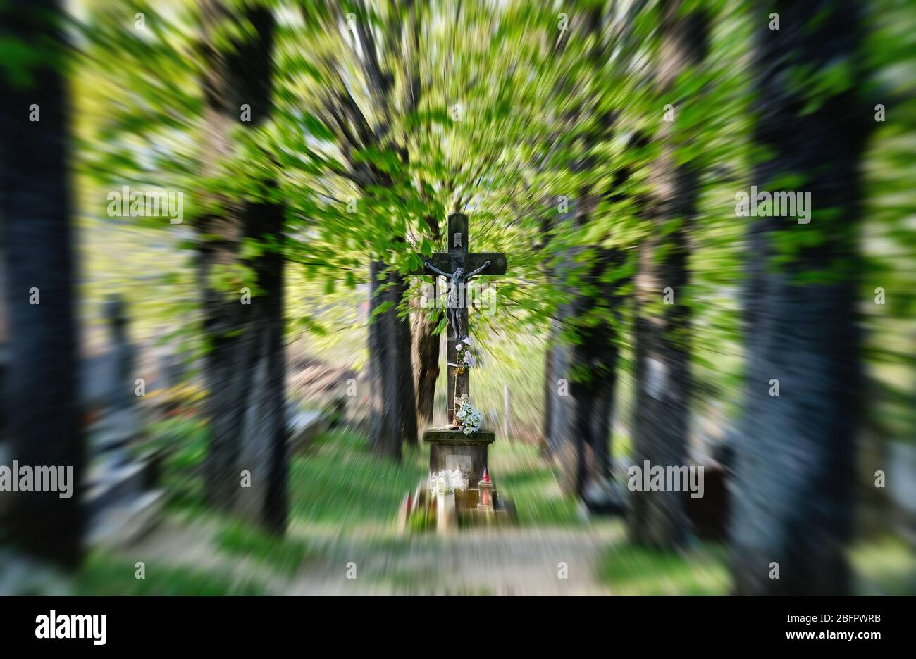Crucified Jesus statue in the cemetery Stock Photo - Alamy