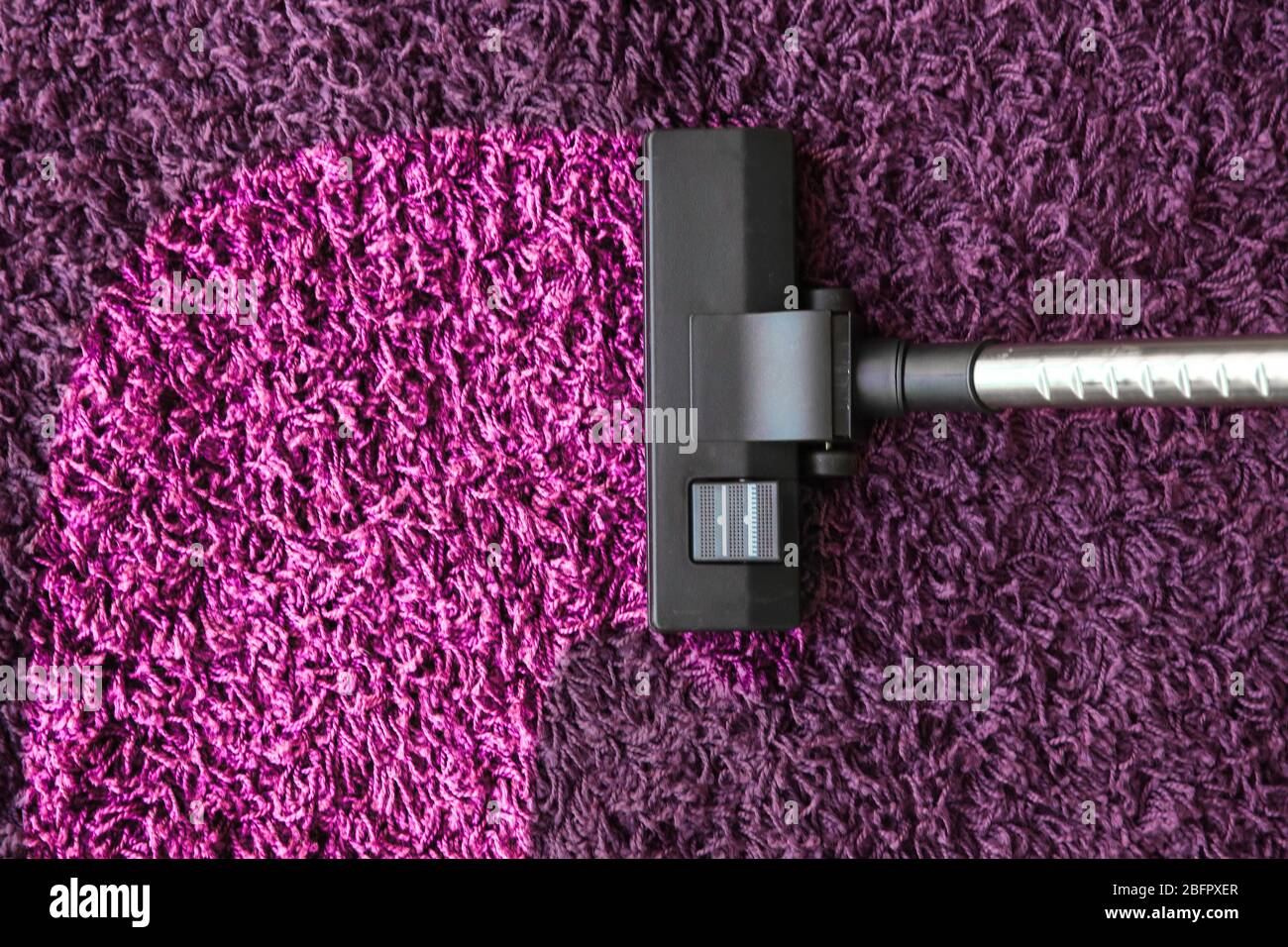 Vacuum cleaner removing dirt from carpet Stock Photo Alamy