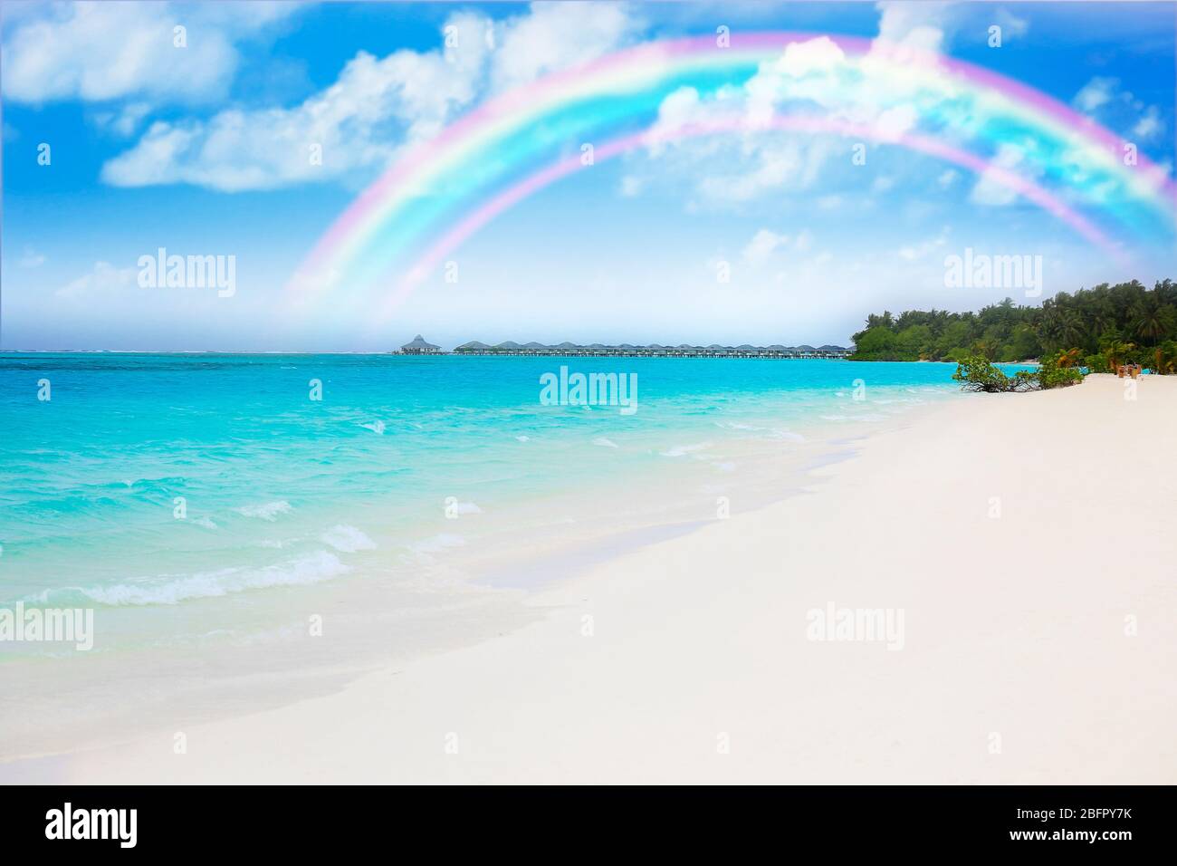 Tropical beach at sea resort and rainbow in sky Stock Photo - Alamy