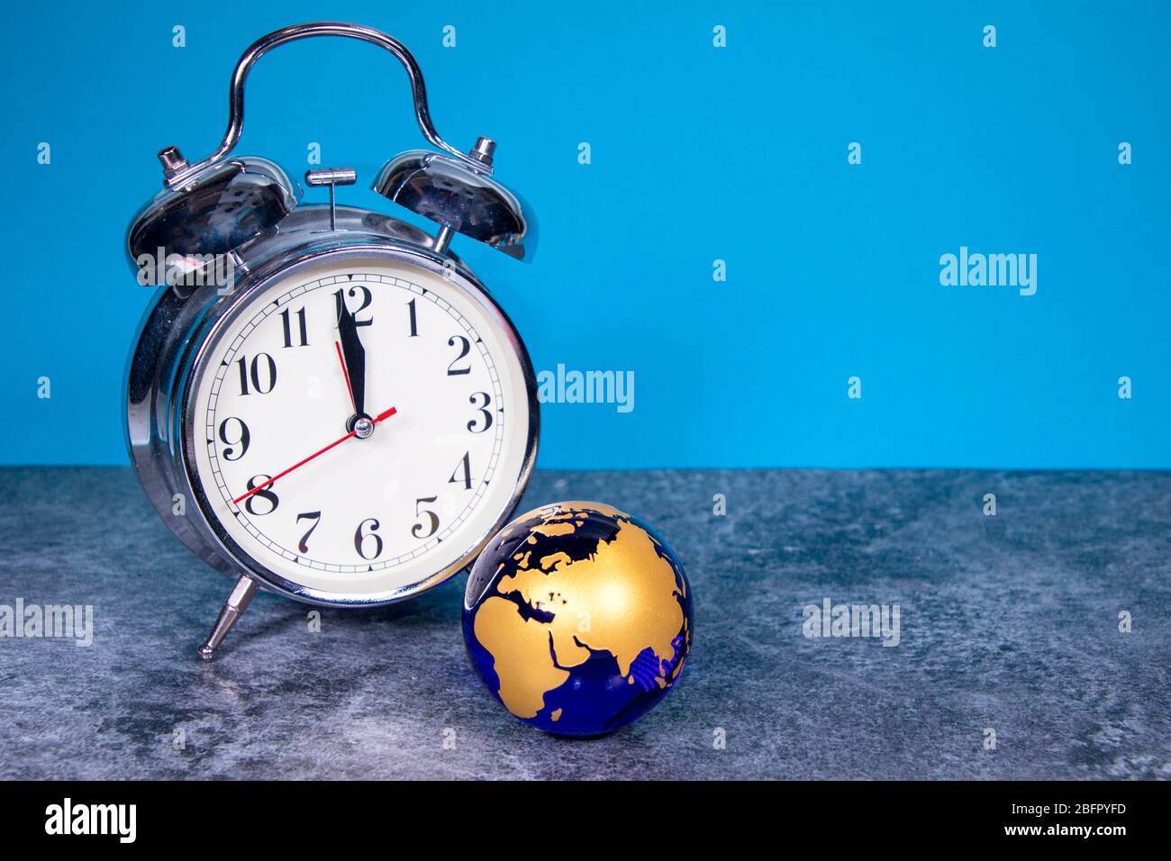 A large analogue clock counts down to a global event or depicts time running out. Stock Photo