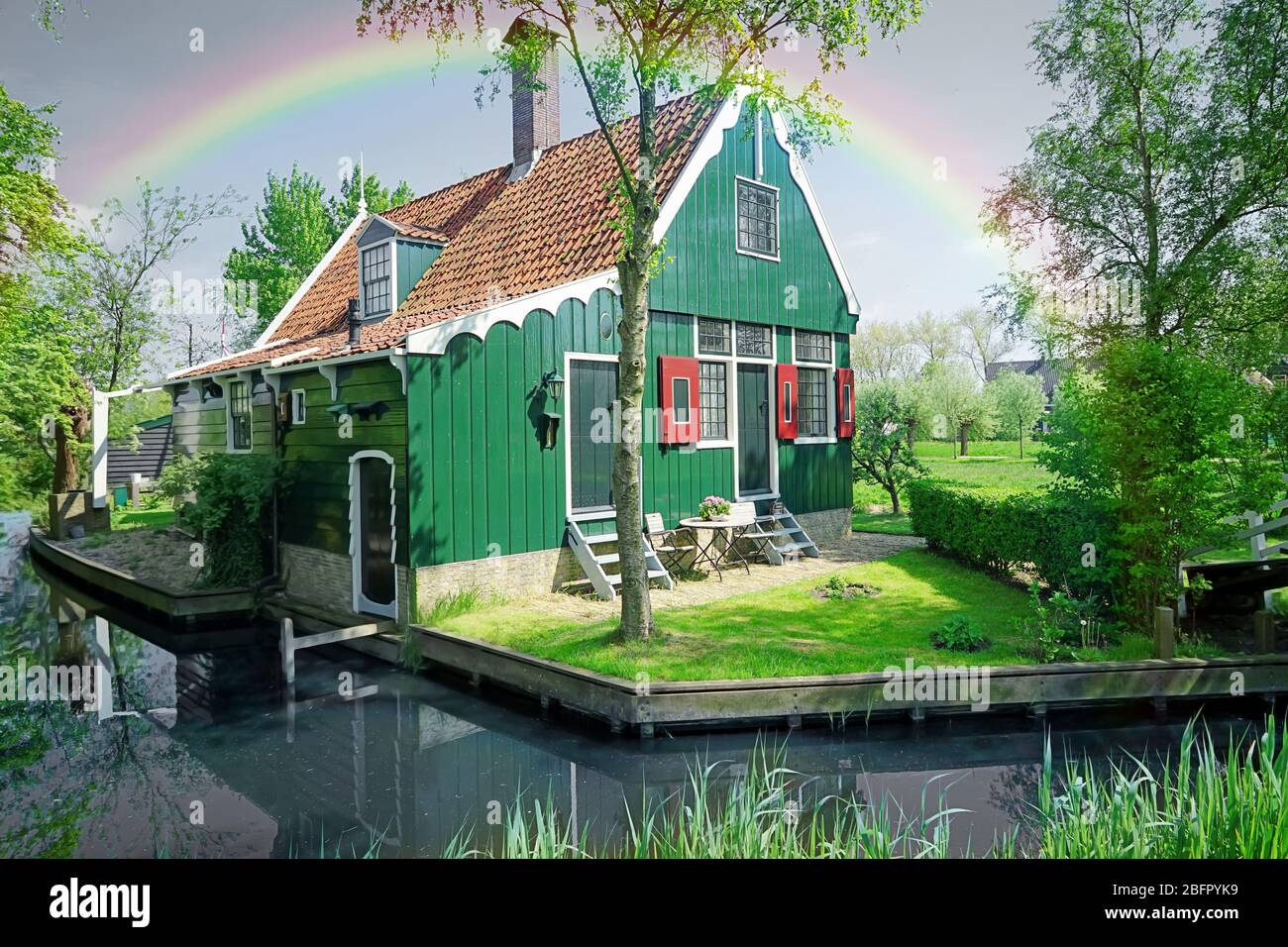 Beautiful rainbow over house Stock Photo - Alamy