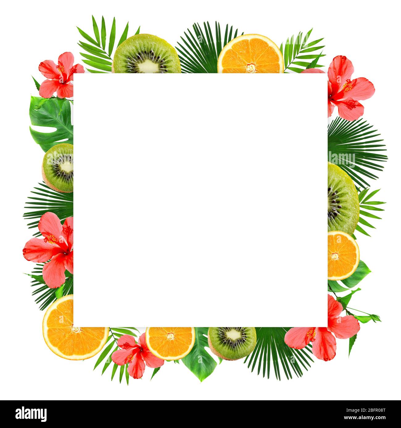Frame of tropical leaves, sliced fruits and flowers on white background ...