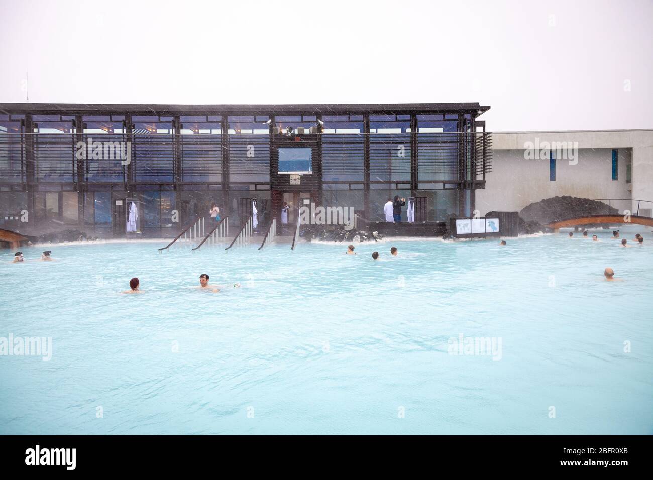 Blue Lagoon Geothermal Spa Pool near Reykjavik in Iceland with steam rising off it on a cold day in winter Stock Photo