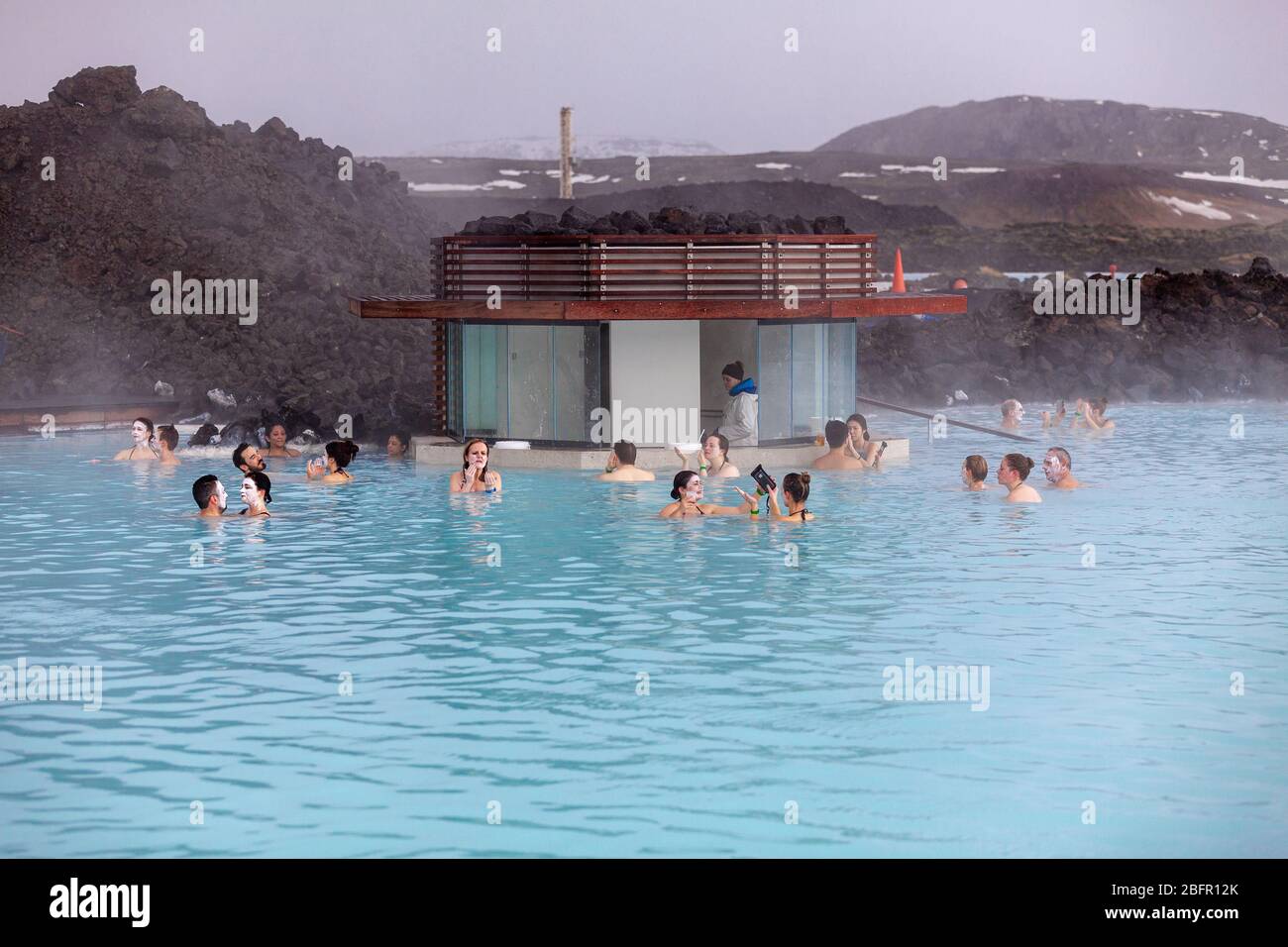 Blue Lagoon Geothermal Spa Pool near Reykjavik in Iceland with steam rising off it on a cold day in winter Stock Photo