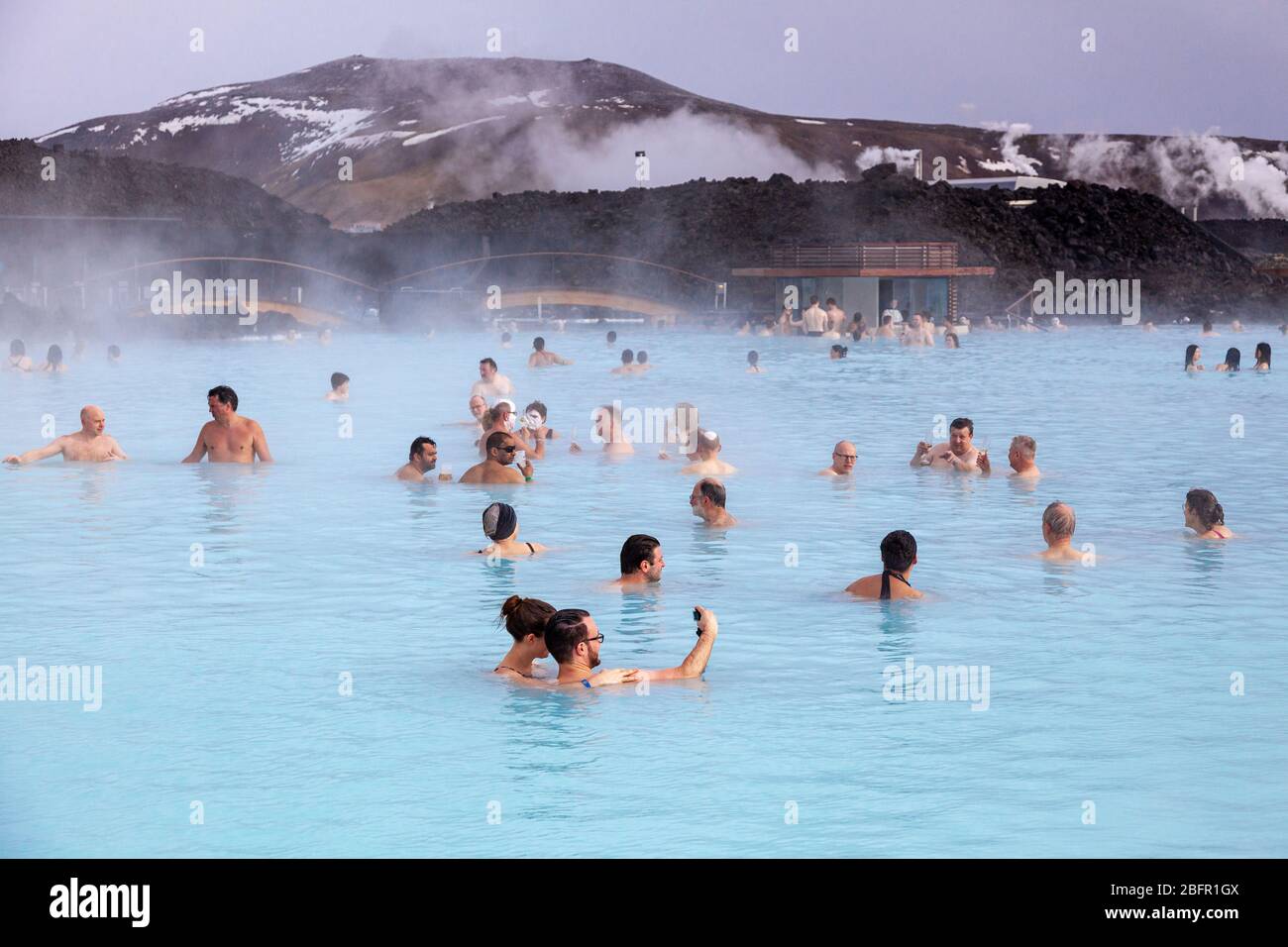 Blue Lagoon Geothermal Spa Pool near Reykjavik in Iceland with steam rising off it on a cold day in winter Stock Photo