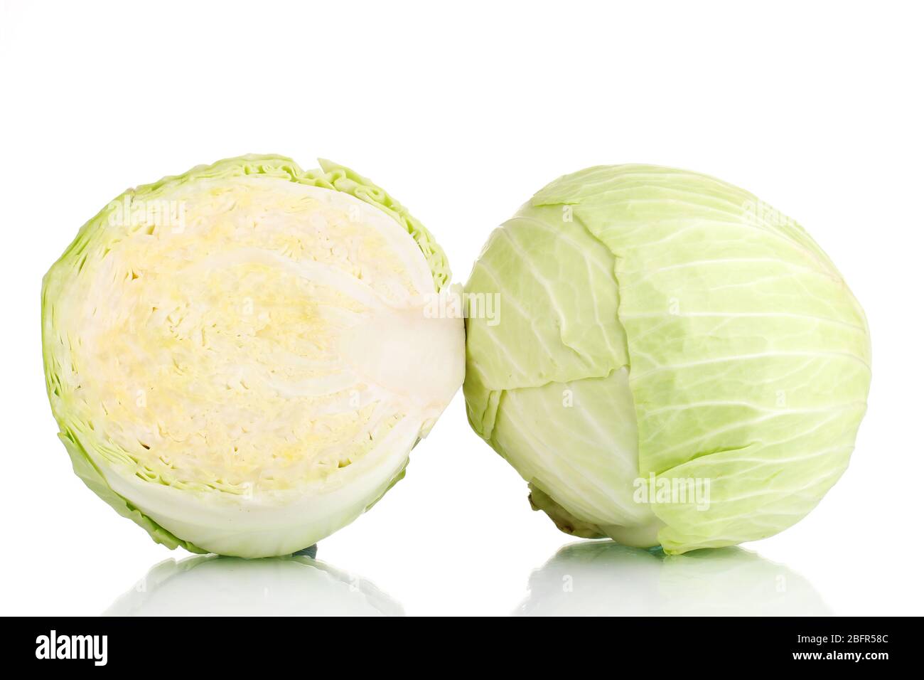 Whole cabbage and half isolated on white Stock Photo - Alamy