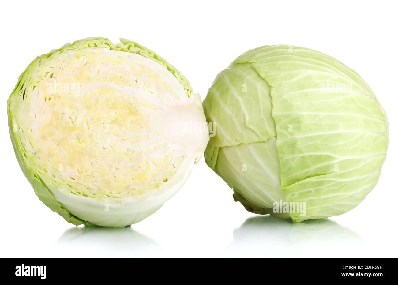 Whole cabbage and half isolated on white Stock Photo - Alamy