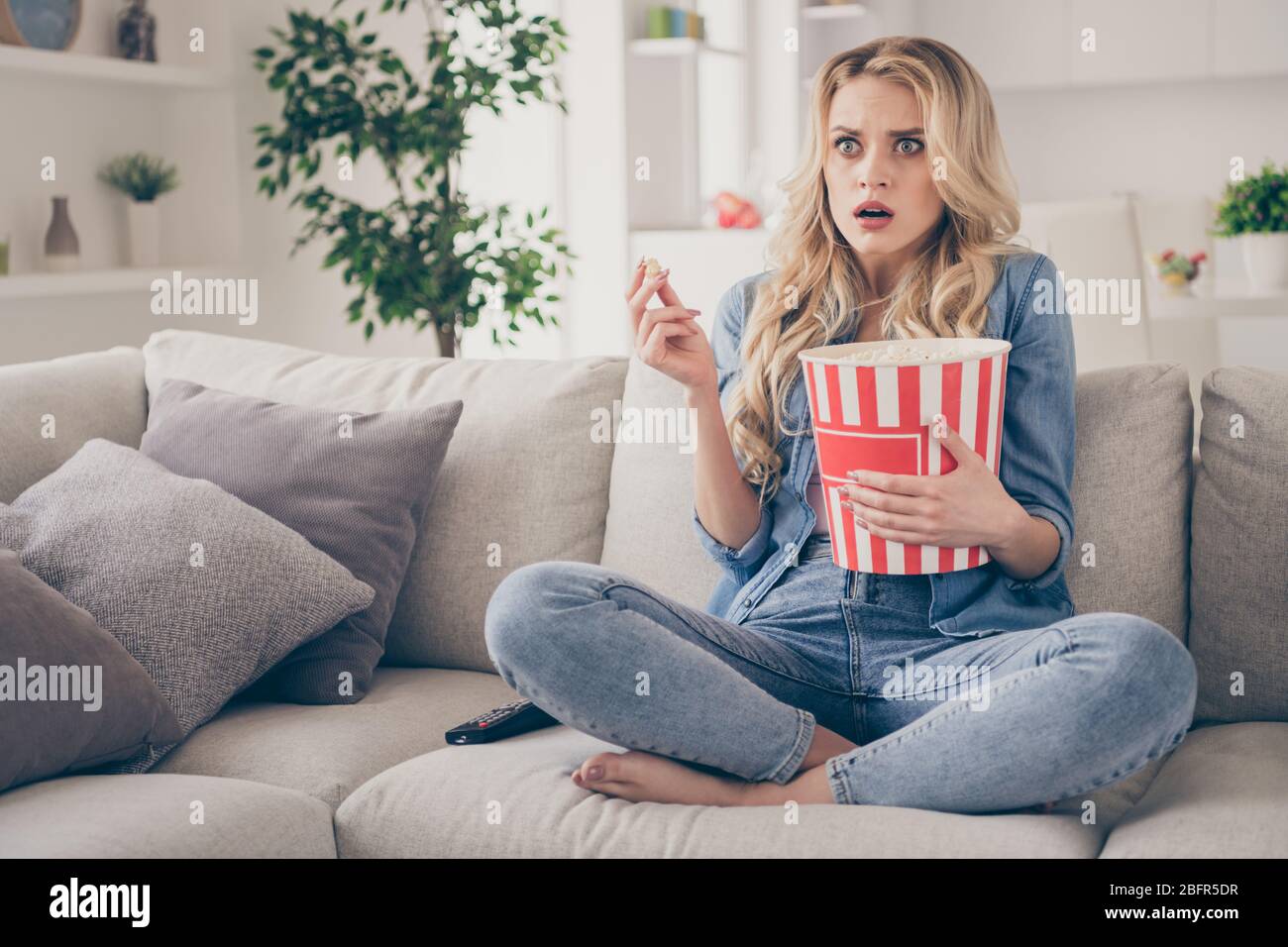 Photo of beautiful crazy terrified barefoot lady sitting comfy couch