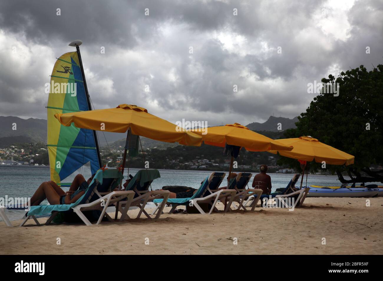 Grand Anse Beach Grenada Tourist sunloungers in the  Rain Stock Photo