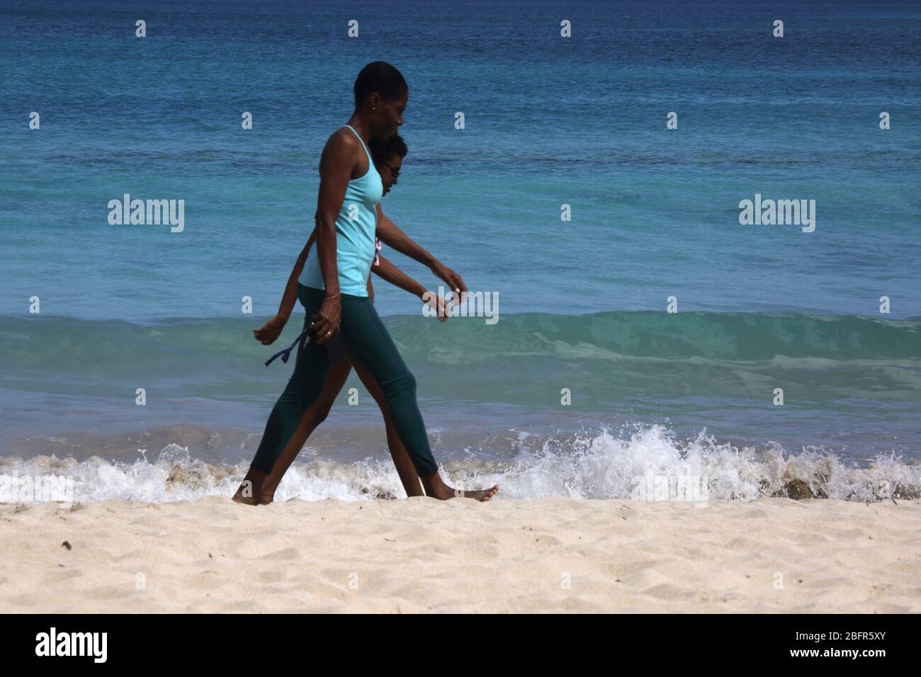 Grand Anse Beach Grenada  Women  walking along the shore Stock Photo