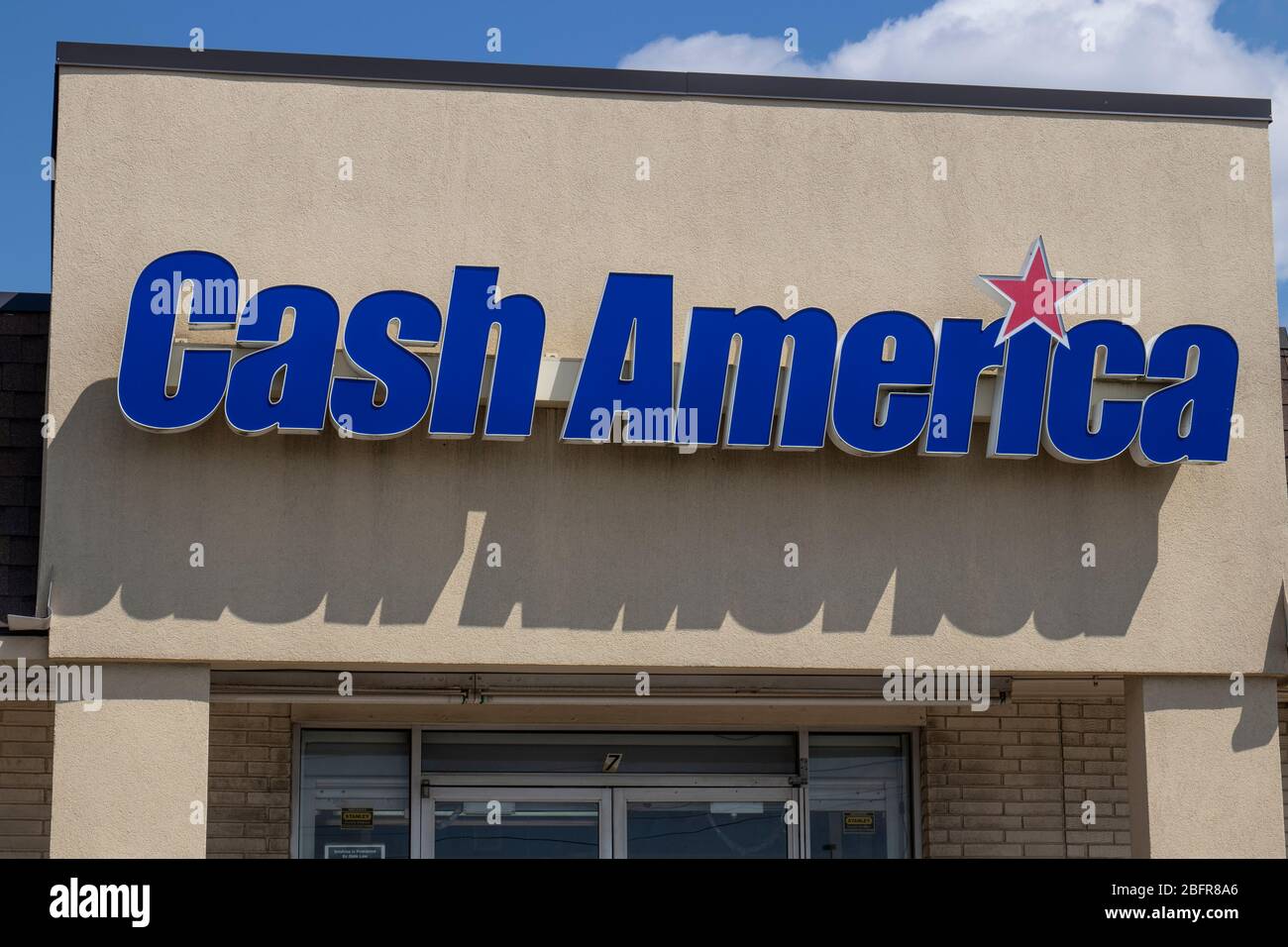 Indianapolis - Circa April 2020: Cash America pawn shop. Cash America operates pawnbroker and payday loan services. Stock Photo