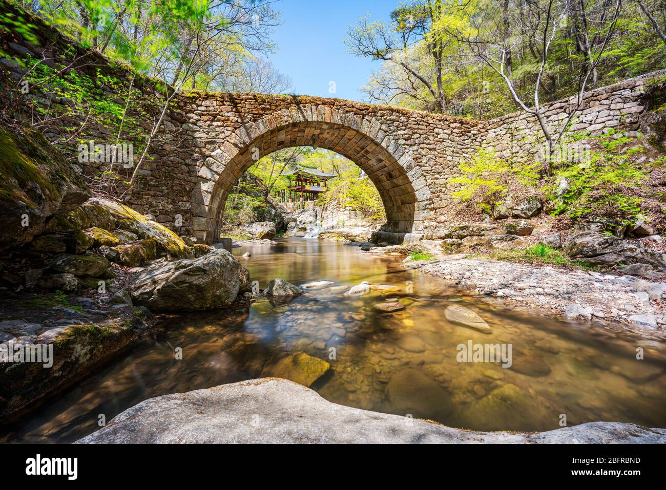 Jogyesan Provincial Park, Korea - 18 APRIL 2020: Seonamsa is famous for its beautiful spring blossoms, as well as its historic arched bridge Seungseon Stock Photo