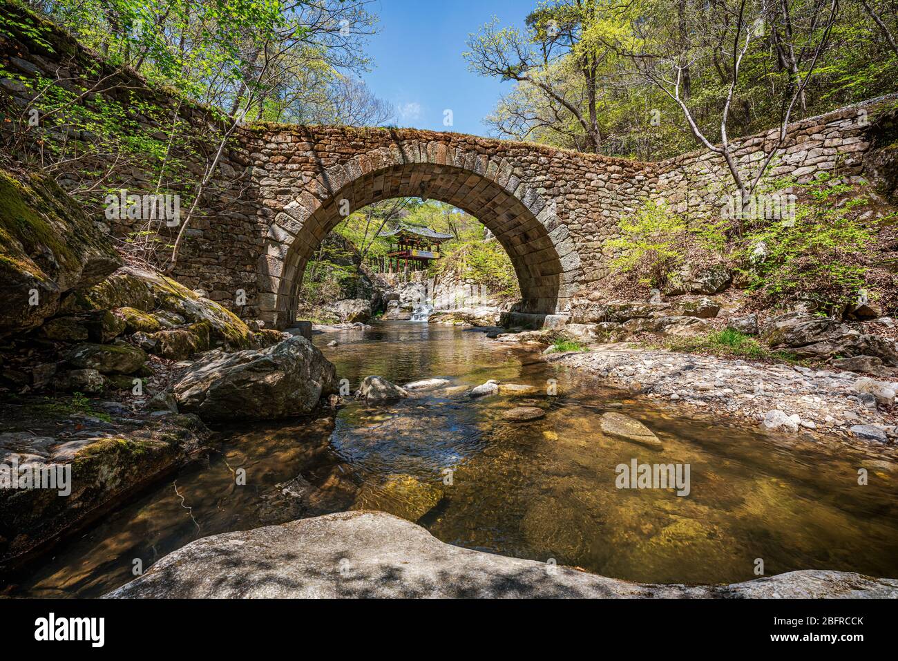 Jogyesan Provincial Park, Korea - 18 APRIL 2020: Seonamsa is famous for its beautiful spring blossoms, as well as its historic arched bridge Seungseon Stock Photo