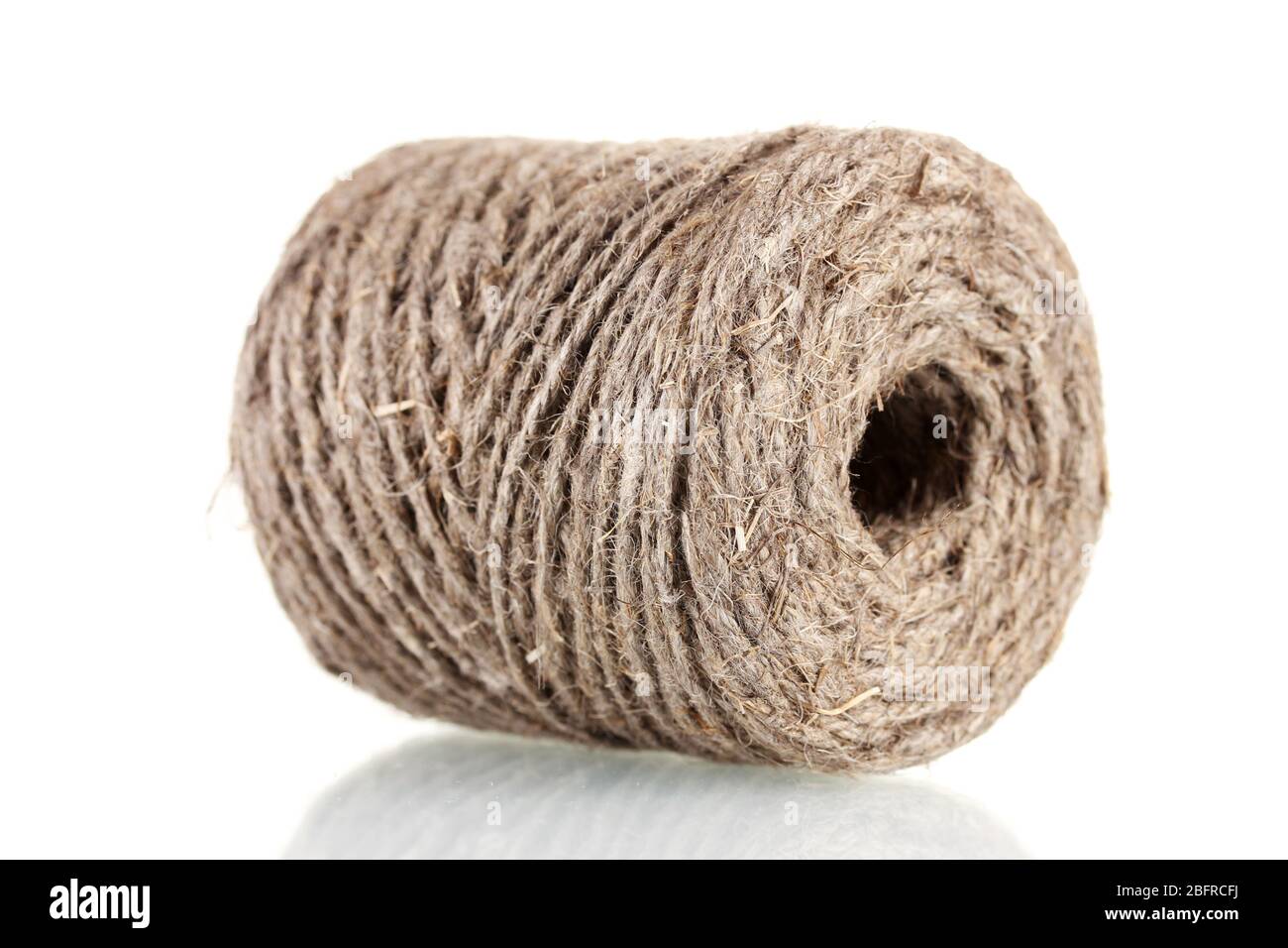 Hank of rope isolated on white Stock Photo - Alamy