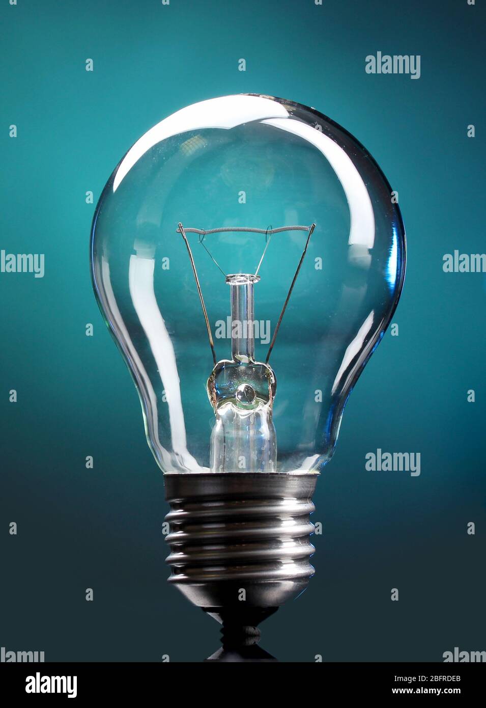 Light bulb on blue background Stock Photo - Alamy