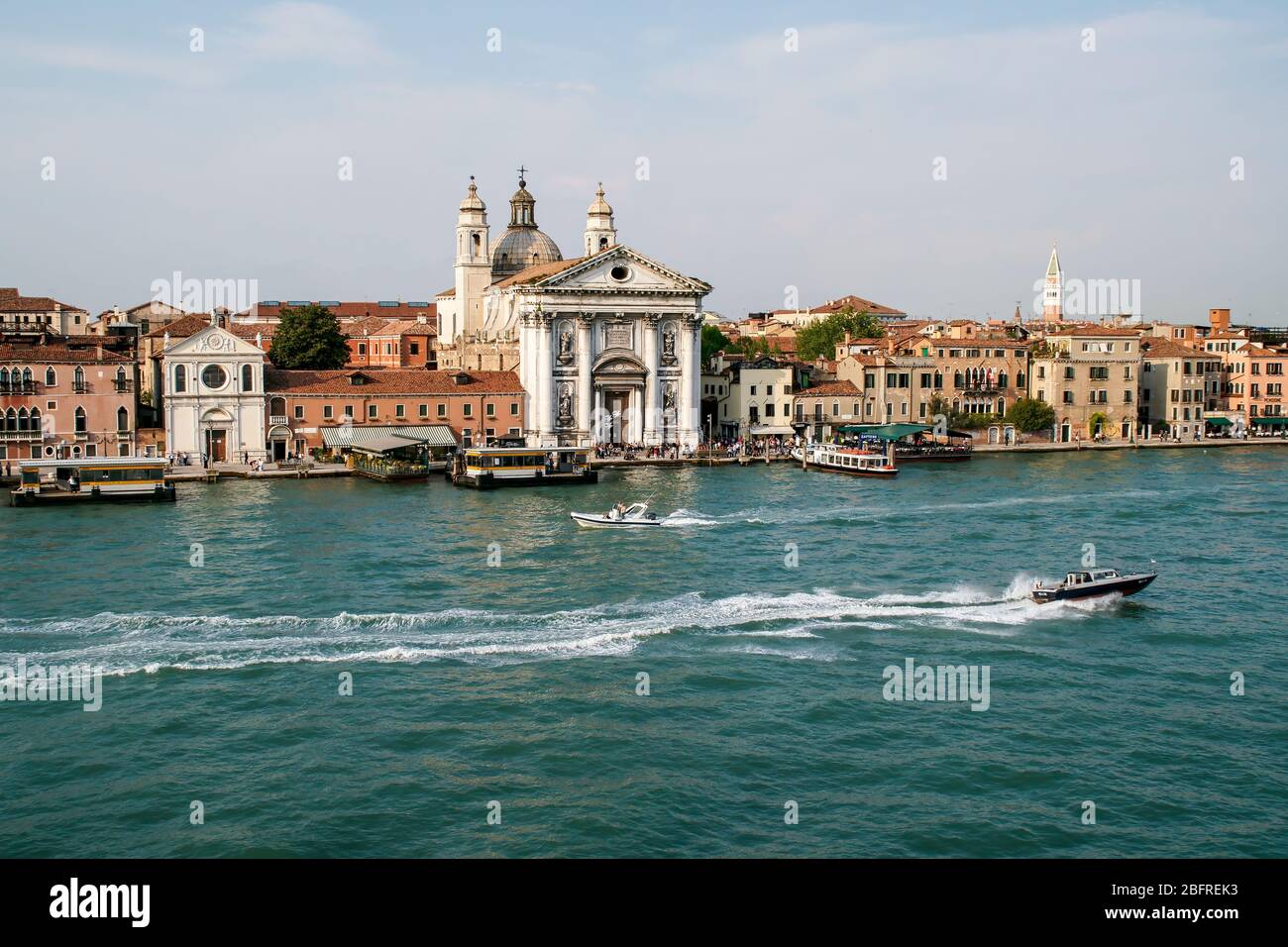 Seen from the Grand Canal. motorboats speed by the Santa maria del Rosario church known as I Gesuati. Stock Photo
