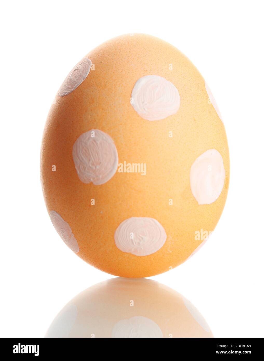 Yellow Easter Egg  with white point isolated on white Stock Photo