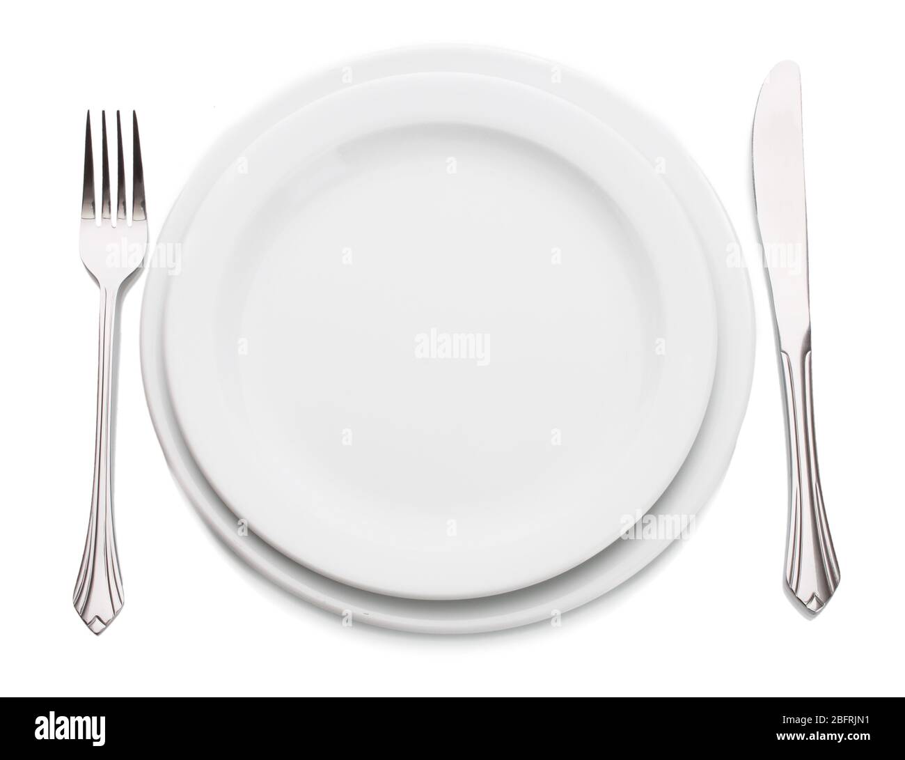 White empty plate with fork and knife isolated on white Stock Photo - Alamy