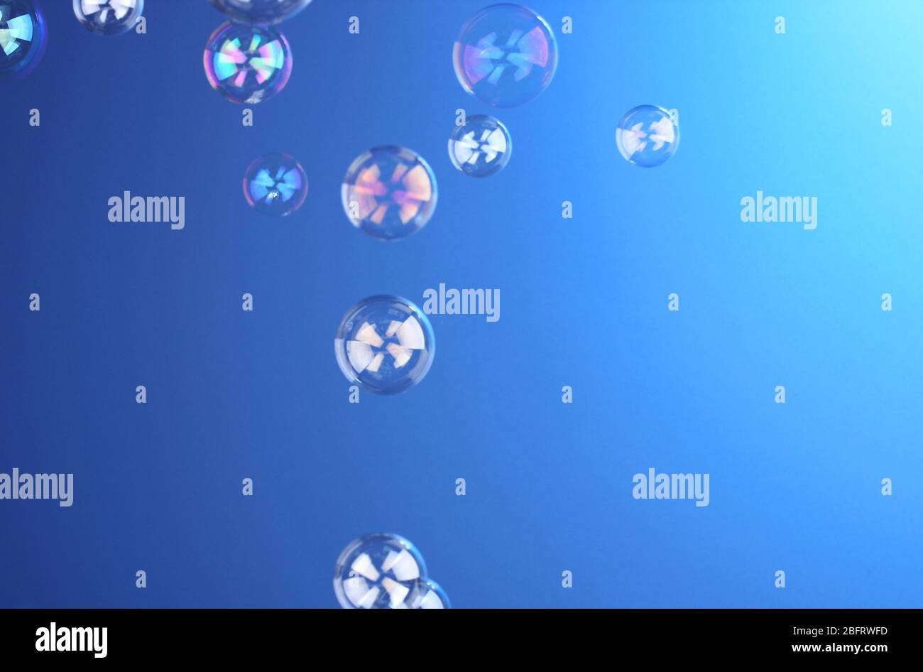 Soap bubble on blue background Stock Photo - Alamy