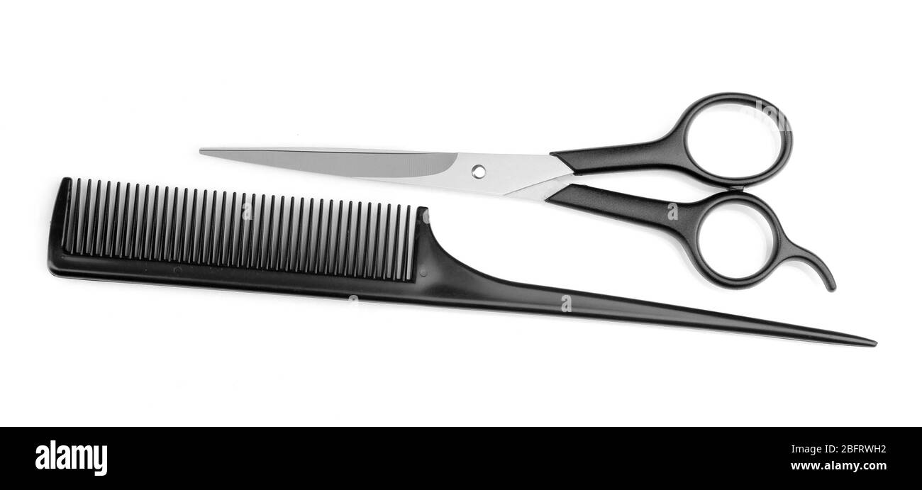 Hair cutting shears and comb isolated on white Stock Photo Alamy