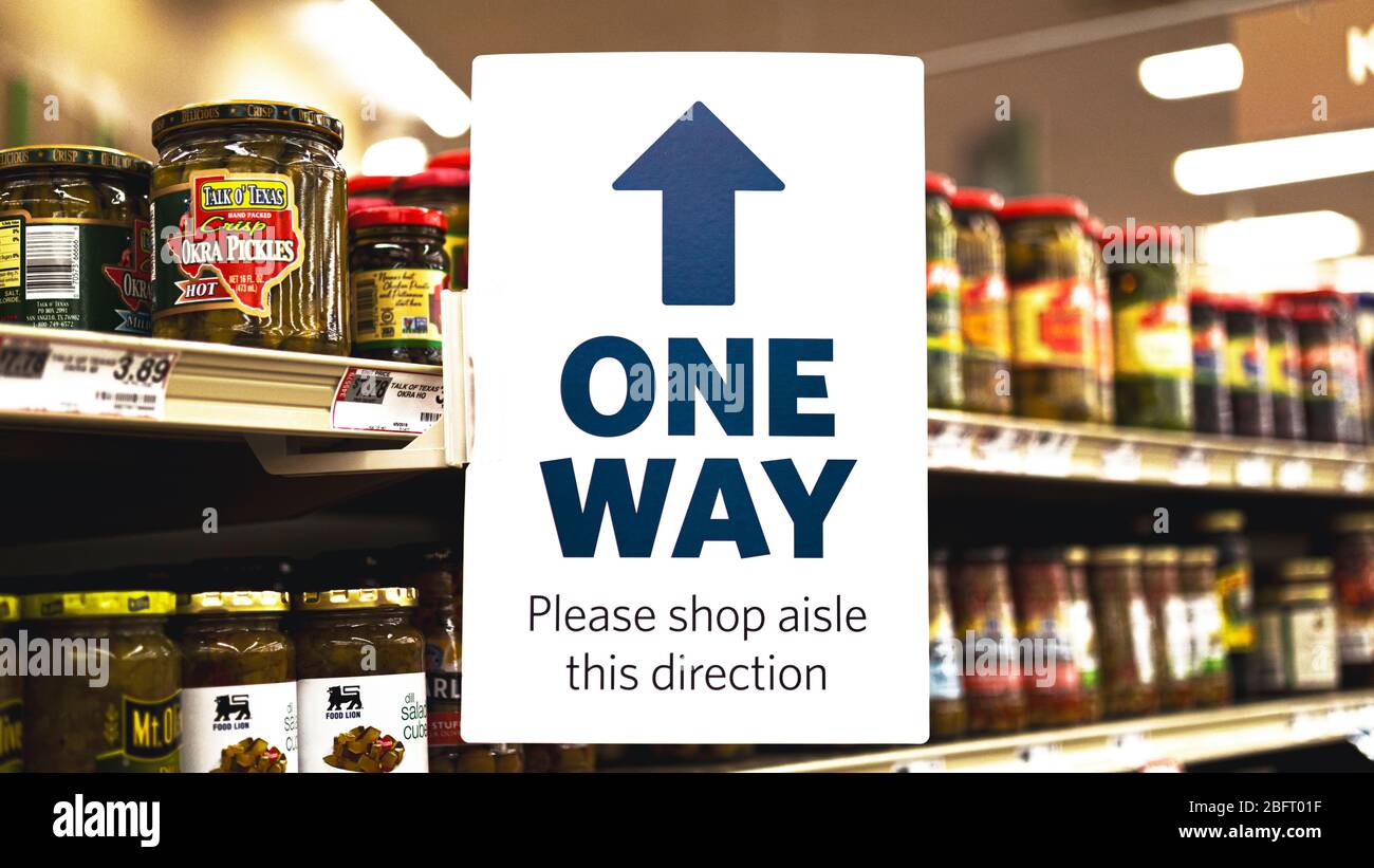 One Way Sign In A Supermarket Aisle During Coronavirus Quarantine Stock Photo