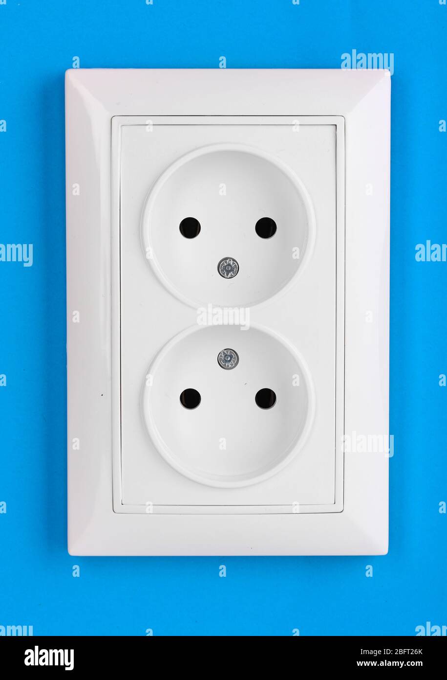 White electric socket on the wall Stock Photo Alamy