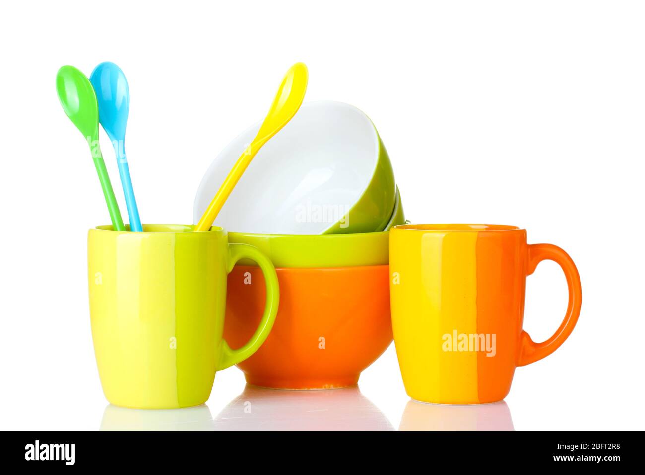 bright empty bowls, cups and spoons isolated on white Stock Photo