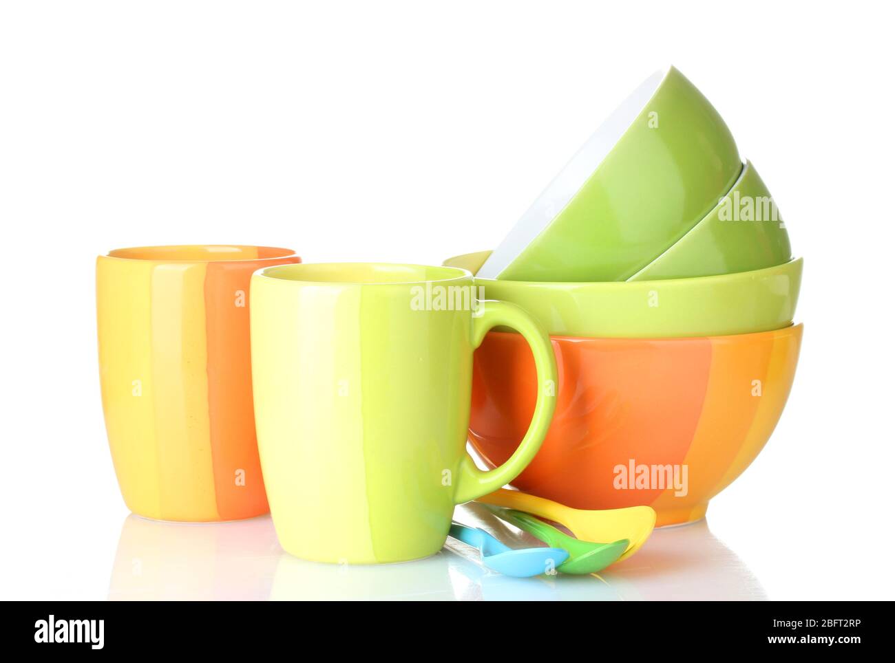 bright empty bowls, cups and spoons isolated on white Stock Photo