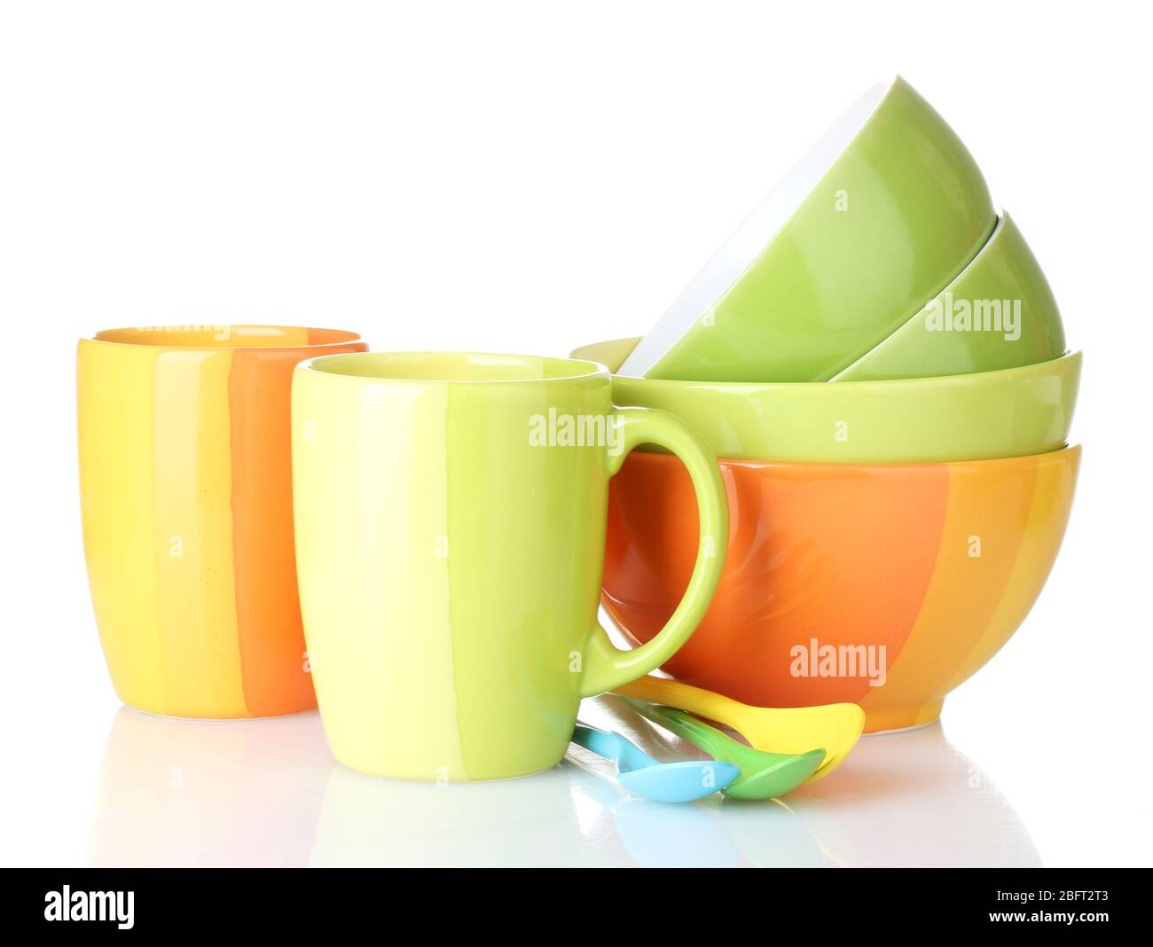 bright empty bowls, cups and spoons isolated on white Stock Photo