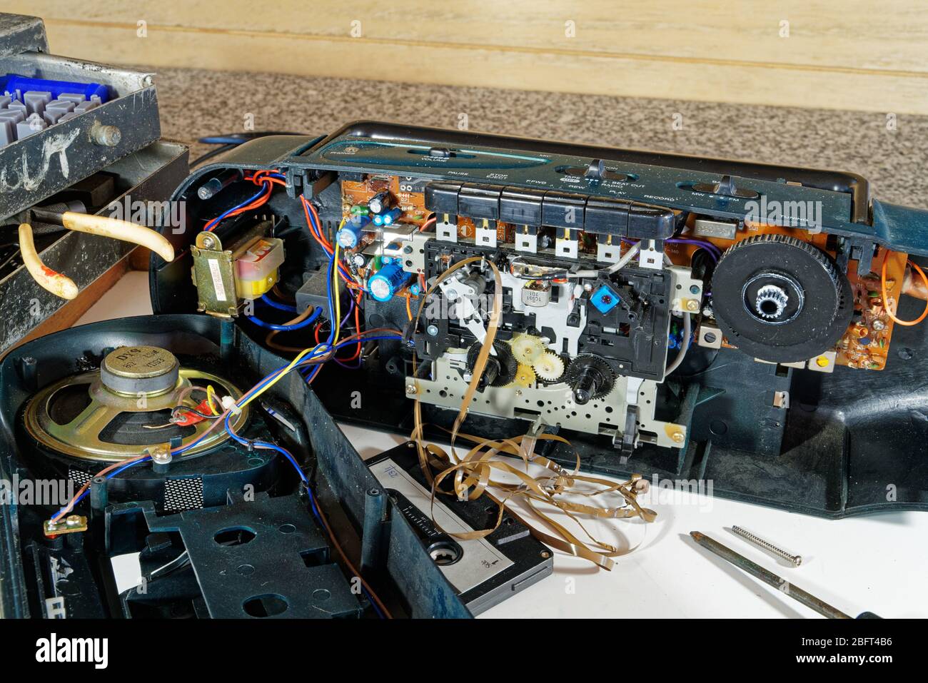 A radio cassette with a tape jam. The right to repair means disassembling products so a home handyman or local repair shop can fix them without specia Stock Photo