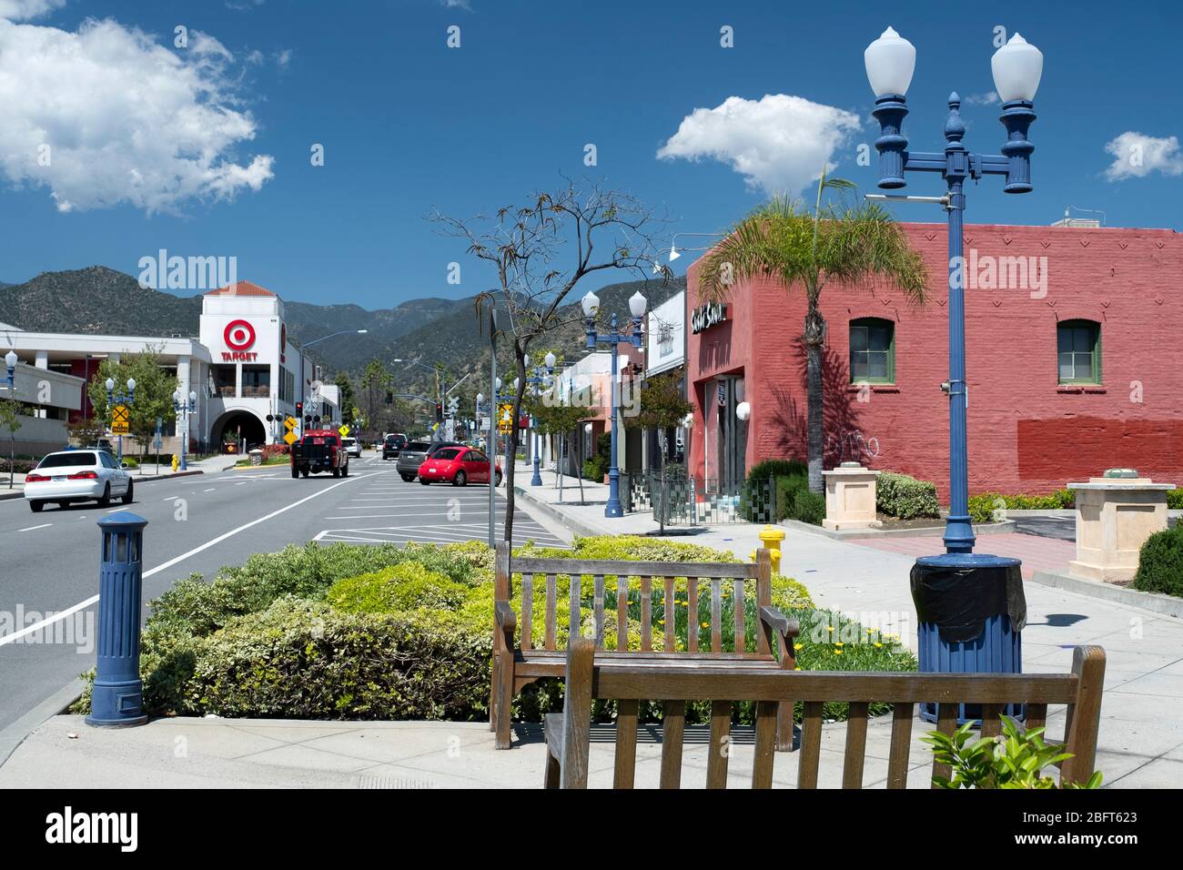 View looking up Azusa Avenue downtown shopping district in the foothills of the San Gabriel Mountains east of Los Angeles Stock Photo