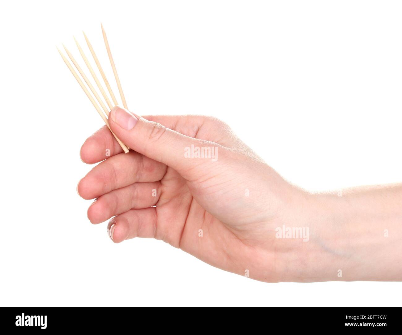 Toothpicks in hand isolated on white Stock Photo Alamy