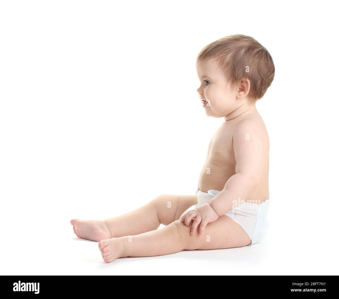 Cute baby girl sitting isolated on white Stock Photo - Alamy