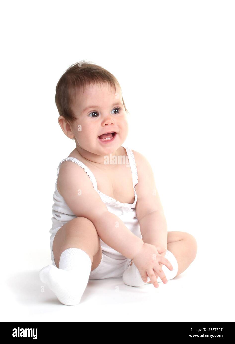 Cute baby girl sitting isolated on white Stock Photo - Alamy