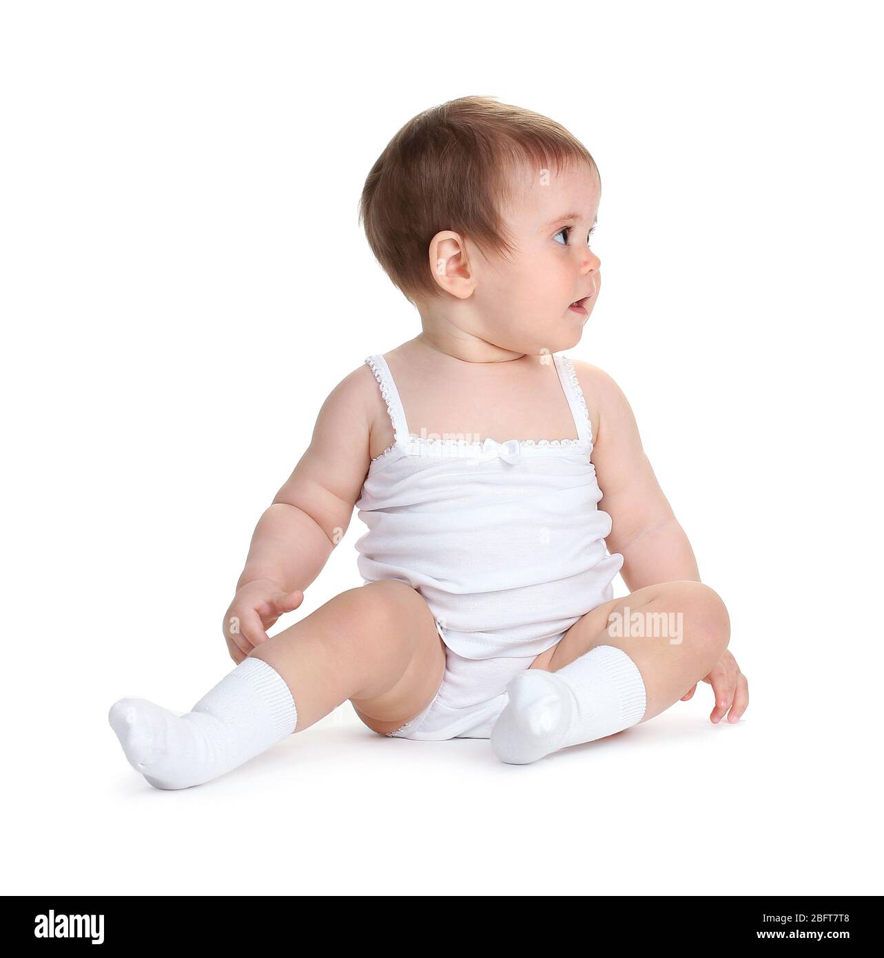 Cute baby girl sitting isolated on white Stock Photo - Alamy